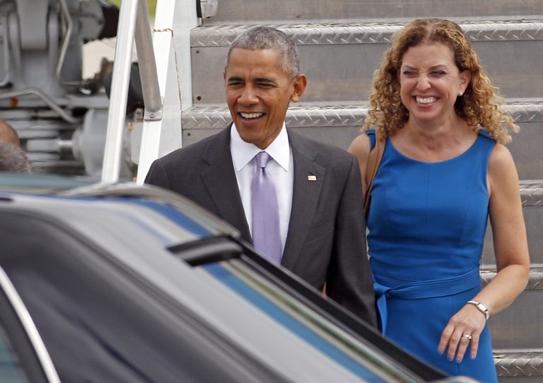 President Barack Obama and Rep. Debbie Wasserman Schultz, D-Fla., smile as they walk down the steps of Air Force One after their arrival at Miami International Airport, Thursday, Oct. 20, 2016, in Miami. Obama is at his highest popularity in his second term. (AP Photo/Alan Diaz)