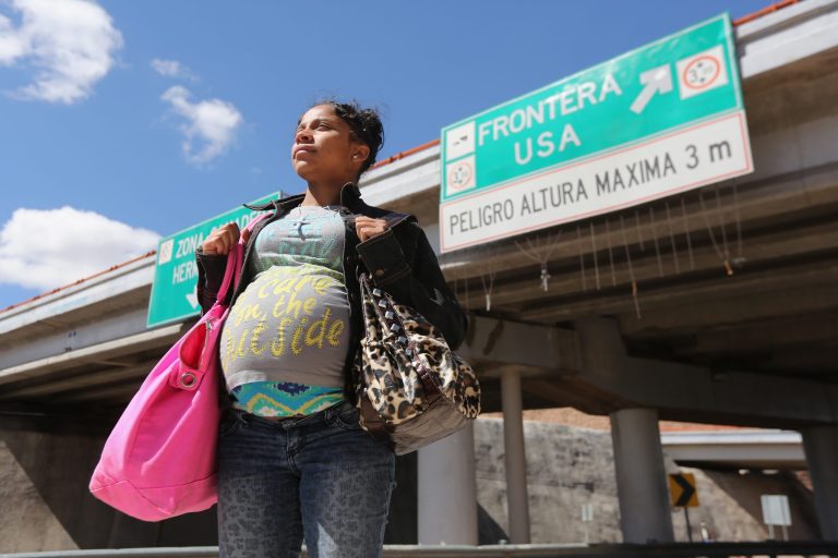 American citizen Lace Rodriguez looks back into Mexico while walking back to the U.S. border after visiting her husband Javier Guerrero on March 10, 2013 in Nogales, Mexico. The family lived together in Phoenix before Guerrero, an undocumented worker from Mexico, said he was detained by the U.S. Border Patrol after being stopped for speeding and drug possession, held for three months by ICE and then deported March 4 to Nogales, Mexico. Guerrero had lived in the United States for 17 years. He and Rodriguez, a medical student, have two children, and she is nine-months pregnant with a third. The splitting up of families has become a major issue as the U.S. works towards immigration reform. (Photo by John Moore/Getty images)
