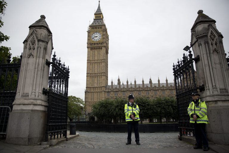 British police officers stand guard outside the Houses of Parliament in London, Monday, Sept. 1, 2014.  Britain's Prime Minister David Cameron is expected on Monday to expand powers to combat terrorism in hopes of preventing attacks by Islamist militants returning from terror training in the Middle East.  (AP Photo/Matt Dunham)