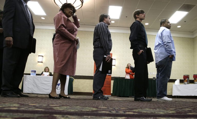 In this Wednesday, Jan. 22, 2014, photo, job seekers line up to meet a prospective employer at a career fair at a hotel in Dallas. Payroll processor ADP reports on job growth at U.S. companies in January on Wednesday, Feb. 5, 2014. (AP Photo/LM Otero)