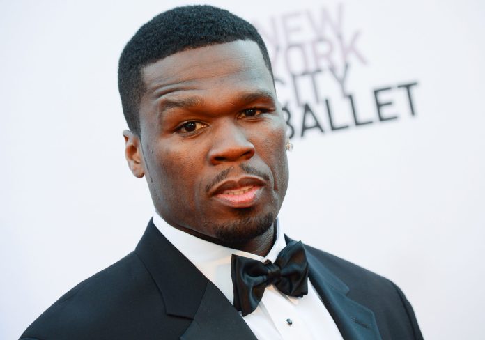 FILE - This Sept. 19, 2013 file photo shows Curtis "50 Cent" Jackson at the New York City Ballet 2013 Fall gala at Lincoln Center in New York. 50 Cent thinks the recent blockbuster deal between Beats by Dre and Apple only helps his headphone company. The rapper unveiled the latest line in SMS Audio at an event on Wednesday, June 18, 2014, with New York Knicks star Carmelo Anthony, a new pitchman and investor. (Photo by Evan Agostini/Invision/AP, File)