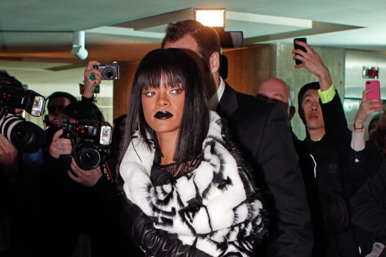 Rihanna arrives at the Gaultier's ready-to-wear fall/winter 2014-2015 fashion collection presented in Paris, Saturday, March 1, 2014. (AP Photo/Thibault Camus)