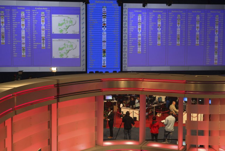 Early results of South African elections are displayed on electric boards at the Independent Electoral Commission Results Center, in Pretoria, South Africa, Thursday, May 8, 2014. Results released by the national election commission showed the African National Congress with about 58 percent and the opposition Democratic Alliance with 28.5 percent after about 3.6 million votes had been counted in Wednesday's election.  (AP Photo/Denis Farrell)
