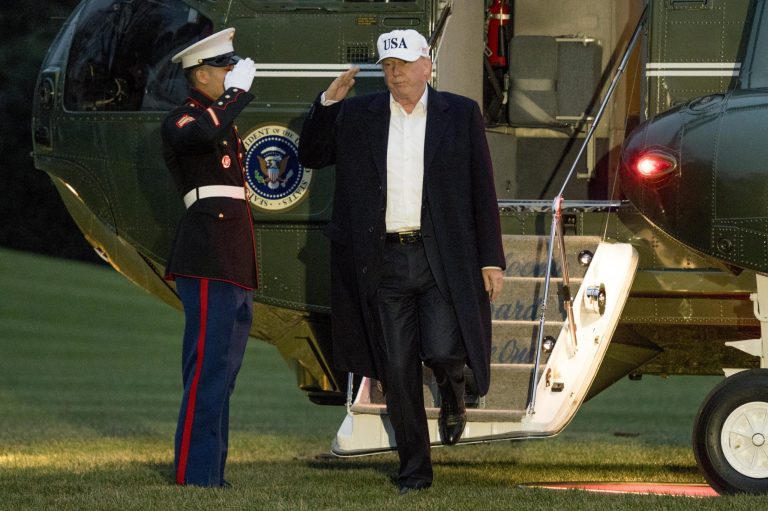President Donald Trump steps off Marine One on the South Lawn at the White House in Washington, Sunday, Dec. 17, 2017, after returning from Camp David in Maryland. (AP Photo/Andrew Harnik)