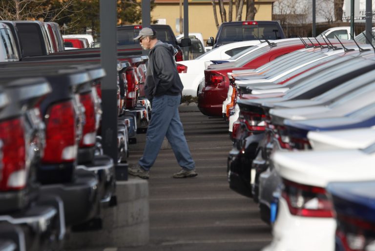 A prospective buyer outside a Dodge showroom in Littleton, Colo. U.S. automobile dealers are growing more pessimistic about future sales as interest rates rise and the Trump administration's tariffs raise the likelihood of price increases. 