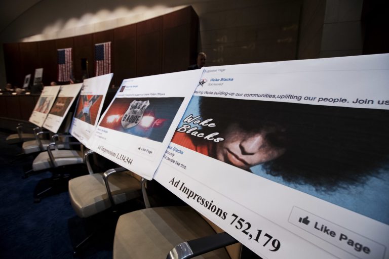 Facebook ads linked to a Russian effort to disrupt the American political process are displayed as Google's Senior Vice President and General Counsel Kent Walker, Facebook's General Counsel Colin Stretch, and Twitter's Acting General Counsel Sean Edgett, testify during a House Intelligence Committee hearing on Capitol Hill in Washington, Wednesday, Nov. 1, 2017. (AP Photo/Manuel Balce Ceneta)