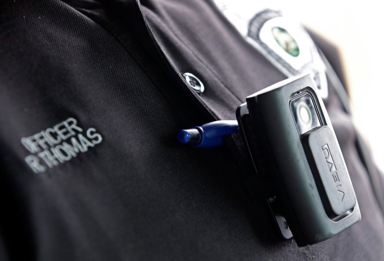 The ICE Body Camera Act would require ICE agents to start wearing body cameras within eighteen months. (AP Photo/Darron Cummings)