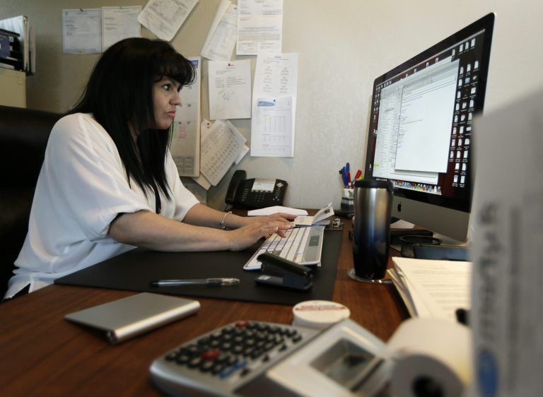 FILE - In this Monday, April 15, 2013, file photo, Consuelo Gomez, of the facilities management company 