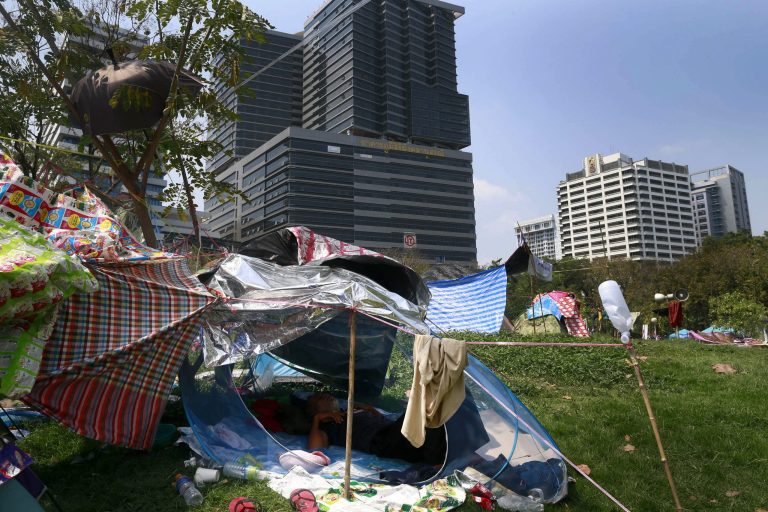 Anti government protester takes a rest at Lumpini park Bangkok, Thailand, Monday, March 3, 2014. Anti-government protesters in Thailand's capital began settling in at a park in the center of Bangkok on Sunday, withdrawing from other sites after their numbers began to dwindle and attackers endangered their security.(AP Photo/Wason Wanichakorn)