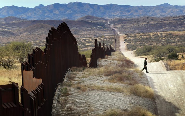 U.S. Border Patrol agent Richard Funke looks for footprints from illegal immigrants crossing the U.S.- Mexico border on December 7, 2010 near Nogales, Arizona. (Photo by John Moore/Getty images)