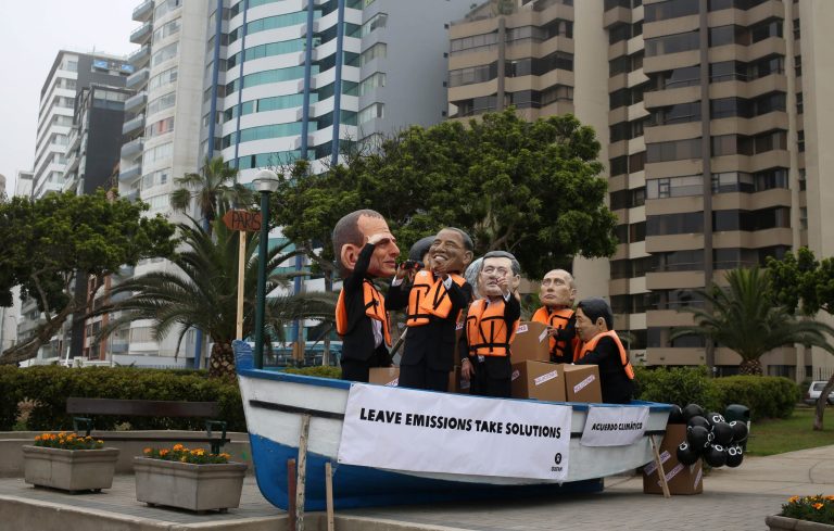 Environmental activists in a boat perform wearing puppet heads representing leaders, from left, Australia's Prime Minister Tony Abbott, President Barack Obama, Canada's Prime Minister Stephen Harper, Russia's President Vladimir Putin and Japan's Prime Minister Shinzo Abe during the Climate Change Conference COP20 in Lima Peru, Friday, Dec. 12, 2014. Delegates from more than 190 countries are meeting in Lima to work on drafts for a global climate deal that is supposed to be adopted next year in Paris. (AP Photo/Martin Mejia)