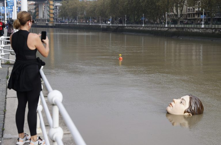Sculpture 'Bihar' ('Tomorrow' in Basque language)(R, down), by Mexican artist Ruben Orozco, is seen in a estuary in Bilbao, Basque Country, northern Spain, 22 September 2021. 