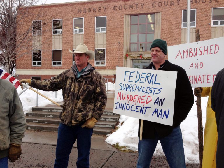 Protesters stand in front of the Harney County Courthouse in Burns, Ore. (AP Photo/Nicholas K. Geranios)