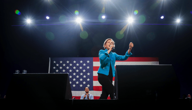 Democratic presidential candidate Sen. Elizabeth Warren, D-Mass., right, address supporters after her introduction by former Secretary of Housing and Urban Development and presidential candidate Julian Castro, left, Tuesday, Jan. 7, 2020, during a campaign stop at Brooklyn's King Theatre in New York. (AP Photo/Bebeto Matthews)