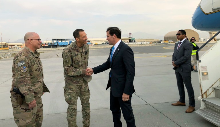 U.S. Defense Secretary Mark Esper, center, is greeted by U.S. military personnel upon arriving in Kabul, Afghanistan, Sunday, Oct. 20, 2019. 