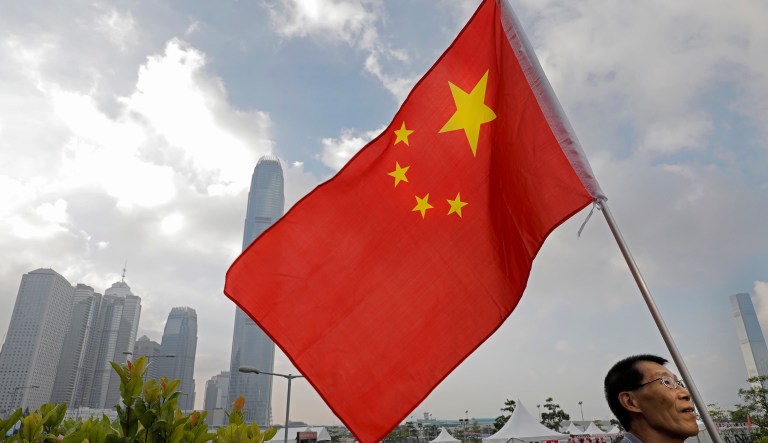 The spy ring obtained the trade secrets in part by bribing employees of the other company, which is not named in the affidavit. (AP Photo/Vincent Yu)