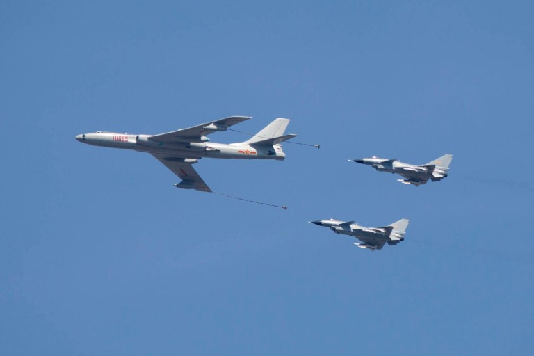 Several bombers and fighter jets flew missions around the Spratly Islands, including surveillance flights and aircraft refueling, Reuters reported. (AP Photo/Mark Schiefelbein)