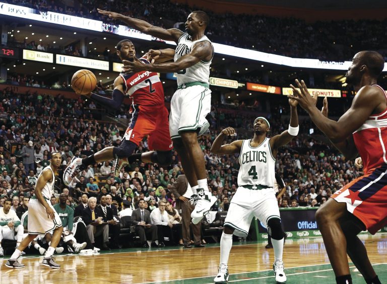 Winslow Townson/AP
Point guard John Wall finished with 16 points and 10 assists as the Wizards lost to the Celtics on the road Sunday night.