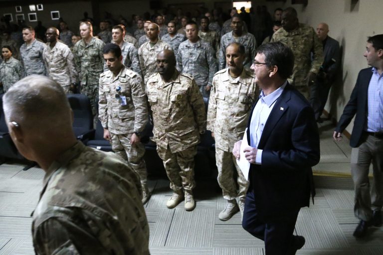 U.S. Defense Secretary Ash Carter, second right, arrives to deliver a speech to troops at Camp Arifjan, Kuwait, Monday, Feb. 23, 2015. (AP Photo/Jonathan Ernst, Pool)