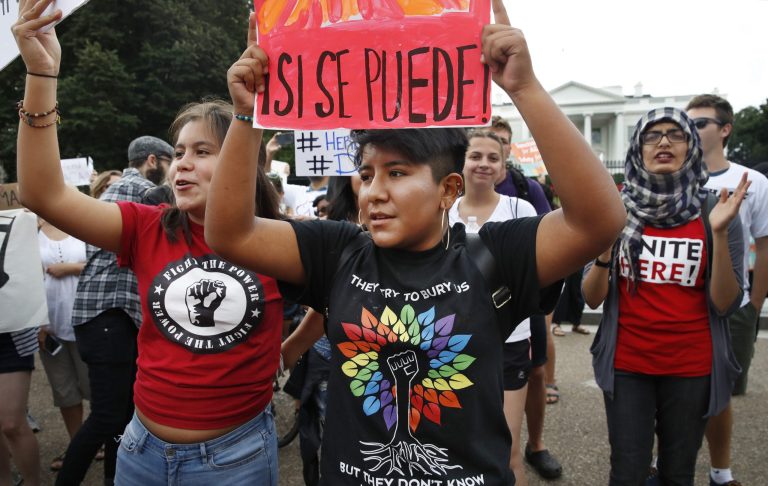 Juliana Torres, 16, left, and Micaela Lattimer, 16, both of Baltimore, rally in support of Deferred Action for Childhood Arrivals, known as DACA, outside of the White House, in Washington, Tuesday, Sept. 5, 2017. President Donald Trump plans to end a program that has protected hundreds of thousands of young immigrants brought into the country illegally as children and call for Congress to find a legislative solution. (AP Photo/Jacquelyn Martin)