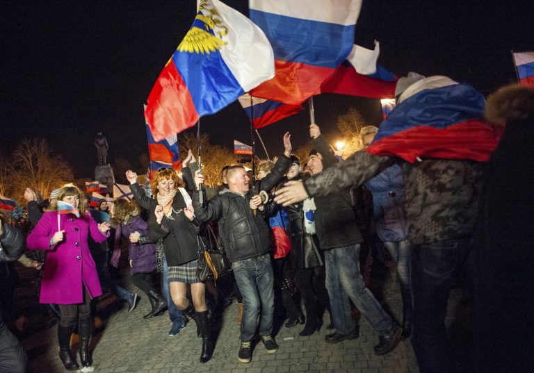 Pro-Russian people celebrate in the central square in Sevastopol, Ukraine, late Sunday. (AP/Andrew Lubimov)