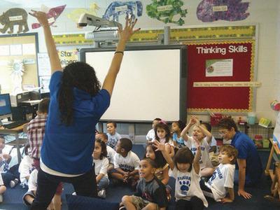 Cristina Ulrich tells her kindergarteners to raise their hands if they're happy about the first day of school at Brookhaven Elementary in Rockville.-Lisa Gartner/For The Examiner