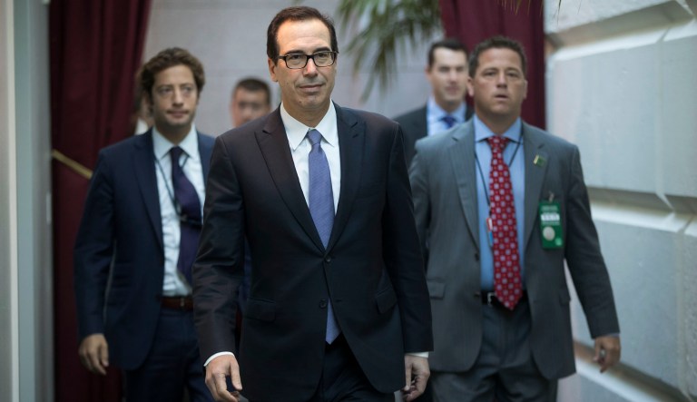 Multinational corporations with profits held overseas would face a mandatory one-time tax as part of the planned Republican tax legislation, Treasury Secretary Steven Mnuchin said Wednesday. (AP Photo/J. Scott Applewhite)