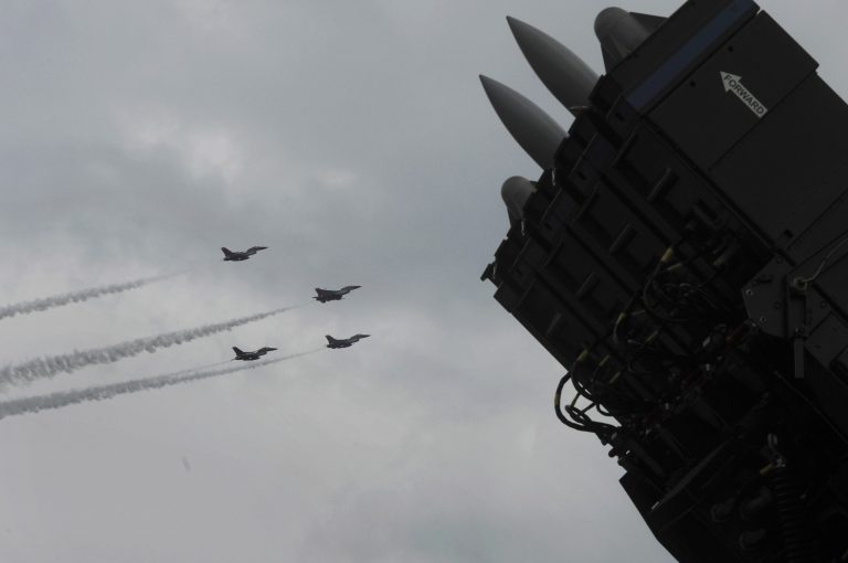 SPYDER, Rafael Advanced Defense Systems' surface-to-air missile system, is on display as F-16 fighter jets of the Singapore Air Force aerobatics team Black Knights perform on the fourth day of the Singapore Airshow in Singapore Friday, Feb. 14, 2014. Rafael Advanced Defense Systems developing a laser-based missile shield that evokes 