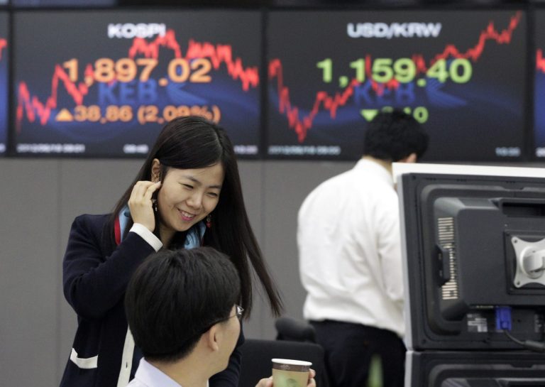   A currency trader reacts during a morning session at the foreign exchange dealing room of the Korea Exchange Bank headquarters in Seoul, South Korea, Monday, June 18, 2012. Asian stock markets climbed Monday after elections in Greece eased fears of global financial turmoil, but analysts warned that the economic crisis shaking the 17 nations in the euro common currency was far from over. South Korea's Kospi rose 2.1 percent at 1,897.83. (AP Photo/Ahn Young-joon)  