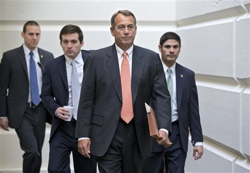 House Speaker John Boehner of Ohio, who conferred with President Barack Obama yesterday by phone, walks to a closed-door meeting with the GOP caucus, Wednesday, Dec. 12, 2012, on Capitol Hill in Washington. Boehner and the other House Republican leaders are calling for Obama to come up with plan they can accept for spending cuts and tax revenue to avoid the so-called 