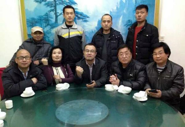 In this Feb. 1, 2014 photo released by Citizen Watchers Group, nine members of a spontaneous Citizens Watchers Group convened at a restaurant to demand a thorough investigation into the death of Xue Fushun, a fellow activistâs father, in Qufu, in eastern China's Shandong province. Scores of activists from around China have been converging on the eastern town during the Chinese New Year holiday to demand an investigation into the death of a fellow activistâs father at a government building. (AP Photo/Citizen Watchers Group, HO)