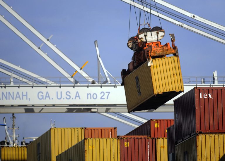 In this Monday, Jan. 27, 2014, photo, a ship to shore crane unloads a shipping container at the Georgia Ports Authority Garden City terminal, in Savannah, Ga. The Commerce Department reports on the U.S. trade deficit for December on Thursday, Feb. 6, 2014. (AP Photo/Stephen B. Morton)