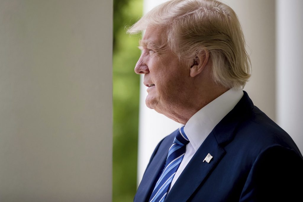 Trump backs down on border wall funding