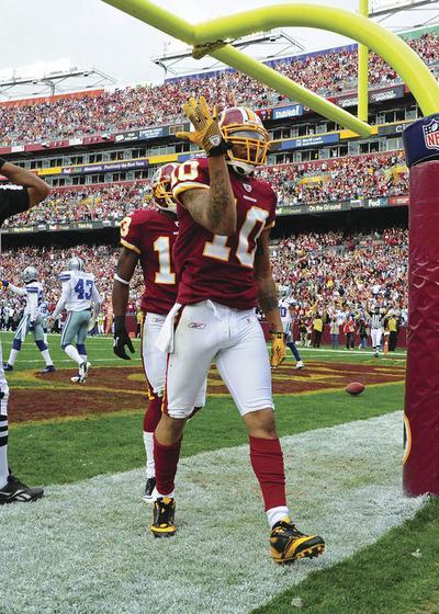 LANDOVER, MD-NOVEMBER 20: Jabar Gaffney#10 of the Washington Redskins celebrates after scoring a touchdown against the Dallas Cowboys at FedEx Field on November 20, 2011 in Landover, Maryland.(Photo by Scott Cunningham/Getty Images)