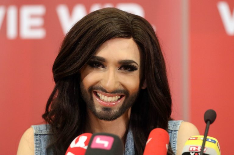 Austrian singer Conchita Wurst attends a press conference in Vienna, Austria Sunday May 11, 2014.  Bearded drag queen Conchita Wurst has made a triumphant return to Austria after winning the Eurovision Song Contest in Copenhagen Saturday,  in what the country's president called a victory for tolerance in Europe. (AP Photo/Ronald Zak)