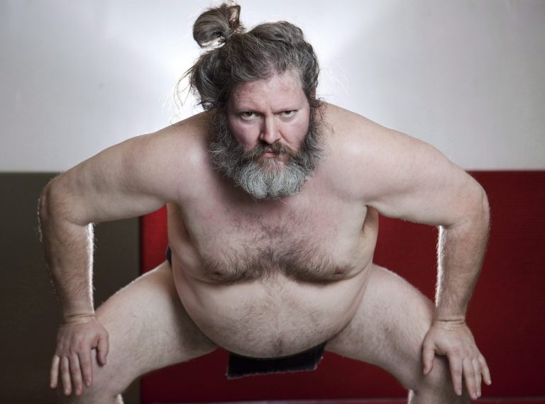   In this March 13, 2012 photo, Elmer Gale poses at his sumo school in Toronto wearing a mawashi, a traditional sumo garment worn during fights. Gale, along with U.S. sumo wrestler Emanuel 