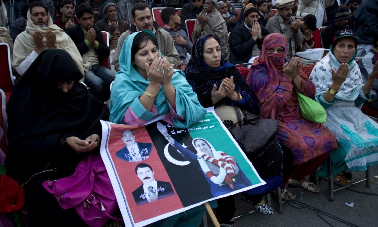   Supporters of Pakistan's assassinated leader Benazir Bhutto pray during her fifth death anniversary in Rawalpindi, Pakistan, Thursday, Dec. 27, 2012. The 24-year-old son of former Pakistani Prime Minister Benazir Bhutto has launched his political career at his ancestral place Larkana, with a fiery speech on the fifth anniversary of his mother's assassination. (AP Photo/B.K. Bangash)  