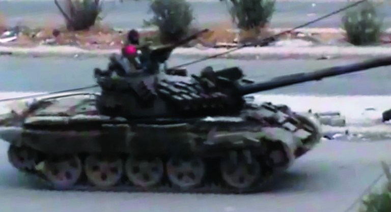 This image taken from video obtained from the Shaam News Network, which has been authenticated based on its contents and other AP reporting, purports to show a Syrian military tank in Daraa, Syria, on Tuesday, Oct. 2, 2012. (AP Photo/Shaam News Network via AP video)