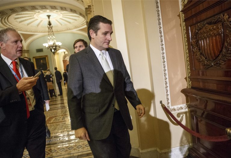 Sen. Ted Cruz, R-Texas arrives at the Senate on Capitol Hill in Washington, Tuesday, Dec. 16, 2014. (AP Photo/J. Scott Applewhite)