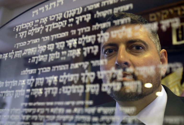 Csanad Szegedi in a Budapest Synagogue. A former high-ranking member of Hungary's far-right Jobbik party, he learned in 2012 that he had Jewish roots. He has since abandoned party politics and taken up the religion of his grandmother, a survivor of the Nazis' Auschwitz death camp. Budapest, Wednesday, May 30, 2014. (AP Photo/Peter Kohalmi)