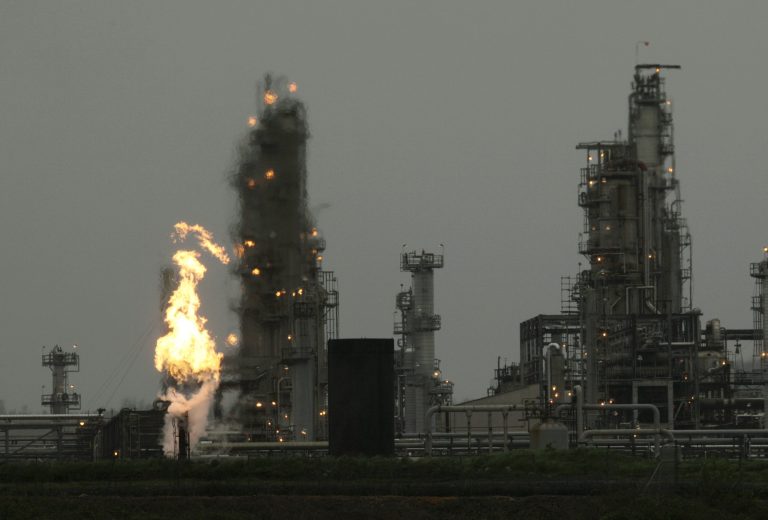A Tesoro Corp. refinery, including a gas flare flame that is part of normal plant operations, is shown Friday, April 2, 2010, in Anacortes, Wash. (AP Photo/Ted S. Warren)
