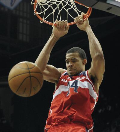 John Amis/AP
Wizards center JaVale McGee had 17 points, 14 rebounds and three blocks against the Celtics on Monday. He will face the Magic's Dwight Howard on Wednesday.