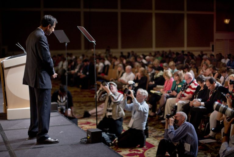 Louisiana Gov. Bobby Jindal bows his head on stage as he leads a prayer for the victims of Charleston church shooting before speaking at the Road to Majority 2015 convention in Washington, Friday, June 19, 2015. (AP Photo/Pablo Martinez Monsivais)