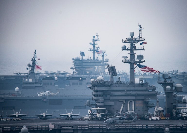 The Carl Vinson and Ronald Reagan carrier strike groups operate alongside Japanese ships in the sea of Japan in this photo released Thursday. (Navy photo)