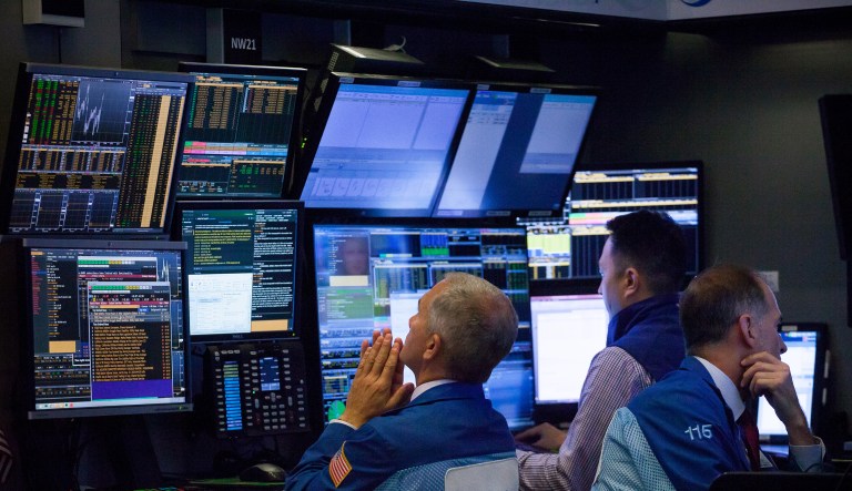 Traders work on the floor of the New York Stock Exchange (NYSE) in New York, U.S., on Monday, Aug. 20, 2018.