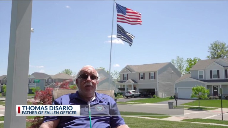 The father of a police officer killed in Ohio fights to keep thin blue line flag flying outside his home