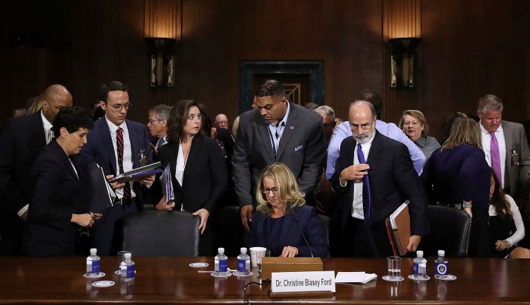 Christine Blasey Ford, seated center, takes a break while testifying before the Senate Judiciary Committee hearing, Thursday, Sept. 27, 2018 in Washington.