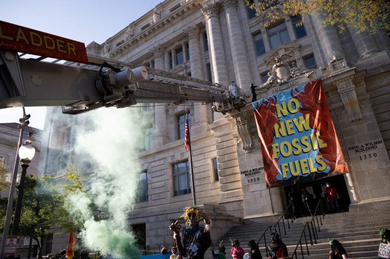 Police arrest protester who scaled DC government building in Earth Day stunt District of Columbia fire fighters remove an Extinction Rebellion demonstrator who scaled the John A. Wilson Building during a rally on Earth Day in Washington, D.C., U.S., on Friday, April 22, 2022.