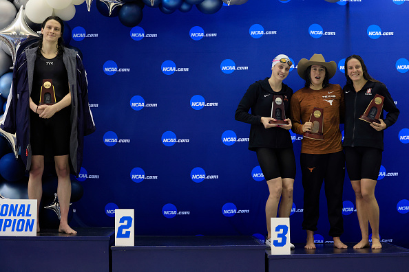Transgender woman Lia Thomas (left) of the University of Pennsylvania stands on the podium after winning the 500-yard freestyle.
