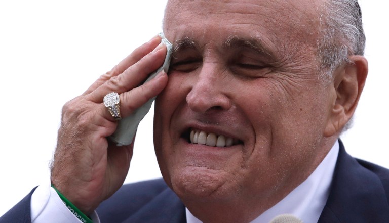 Rudy Giuliani, an attorney for President Donald Trump, pretends to tear a piece of paper as he speaks about the Iran nuclear agreement while speaking at the Iran Freedom Convention for Human Rights and democracy at the Grand Hyatt, Saturday, May 5, 2018, in Washington. 